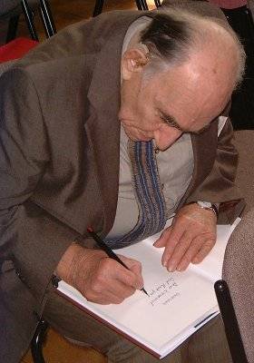 David Leach signing Emmanuel Cooper's personal copy of the David Leach book.